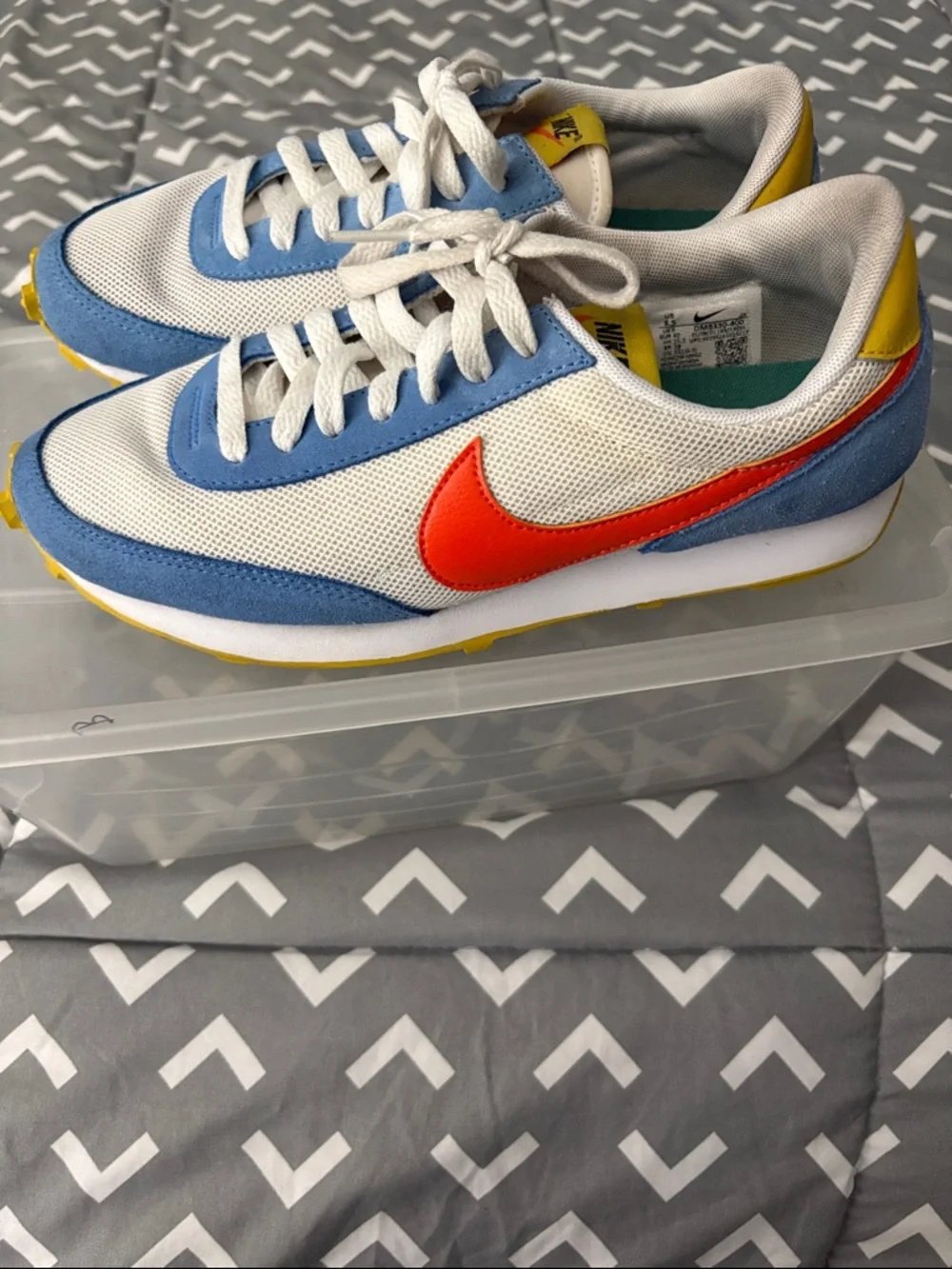 Nike Kids White Sneakers with Light Blue Panels and Orange Swoosh